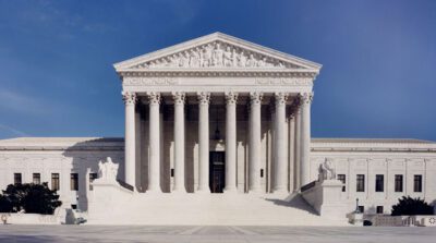 Supreme Court allows a rule limiting pollution from coal-fired power plants to remain in effect