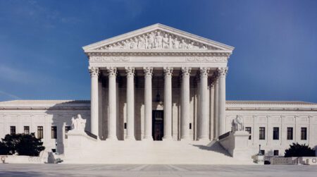 Supreme Court allows a rule limiting pollution from coal-fired power plants to remain in effect